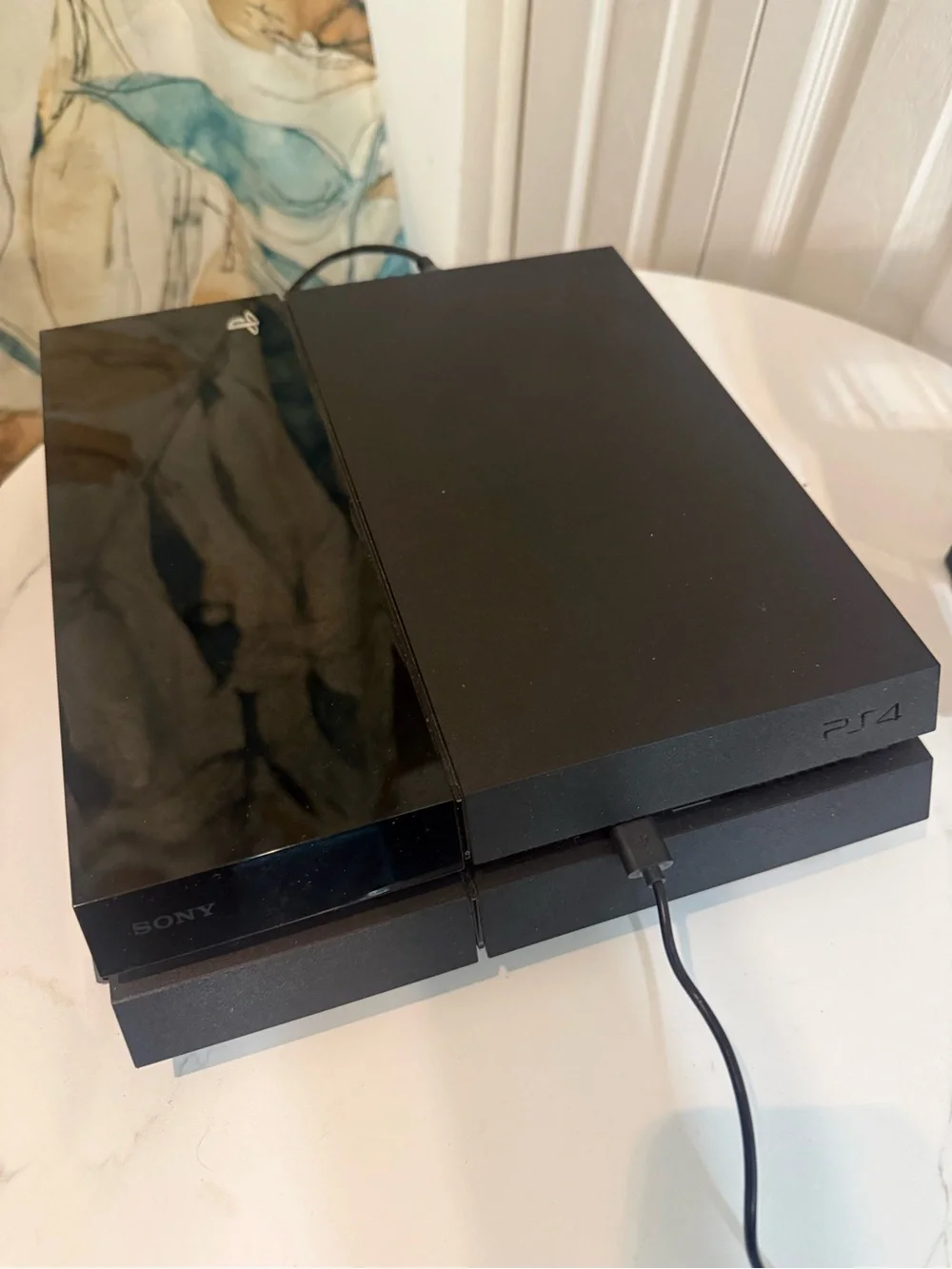 Sony PS4 Console with Black and White DualShock Controllers